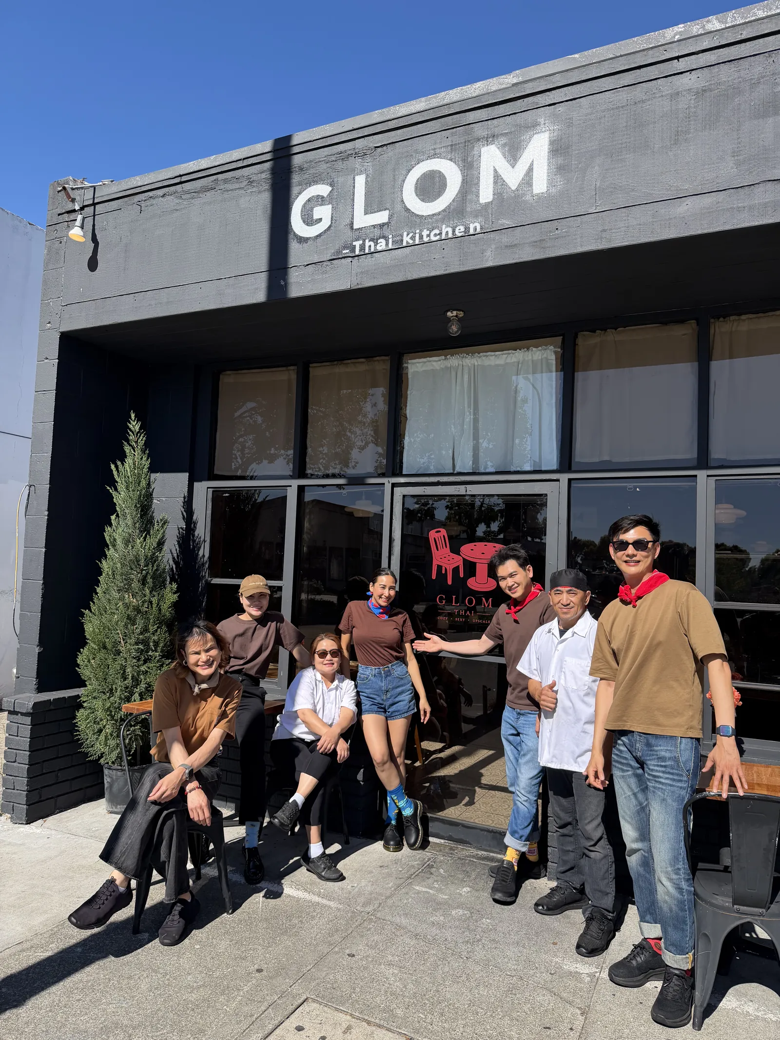 A group gathered outside Glom Thai's storefront on San Pablo Avenue